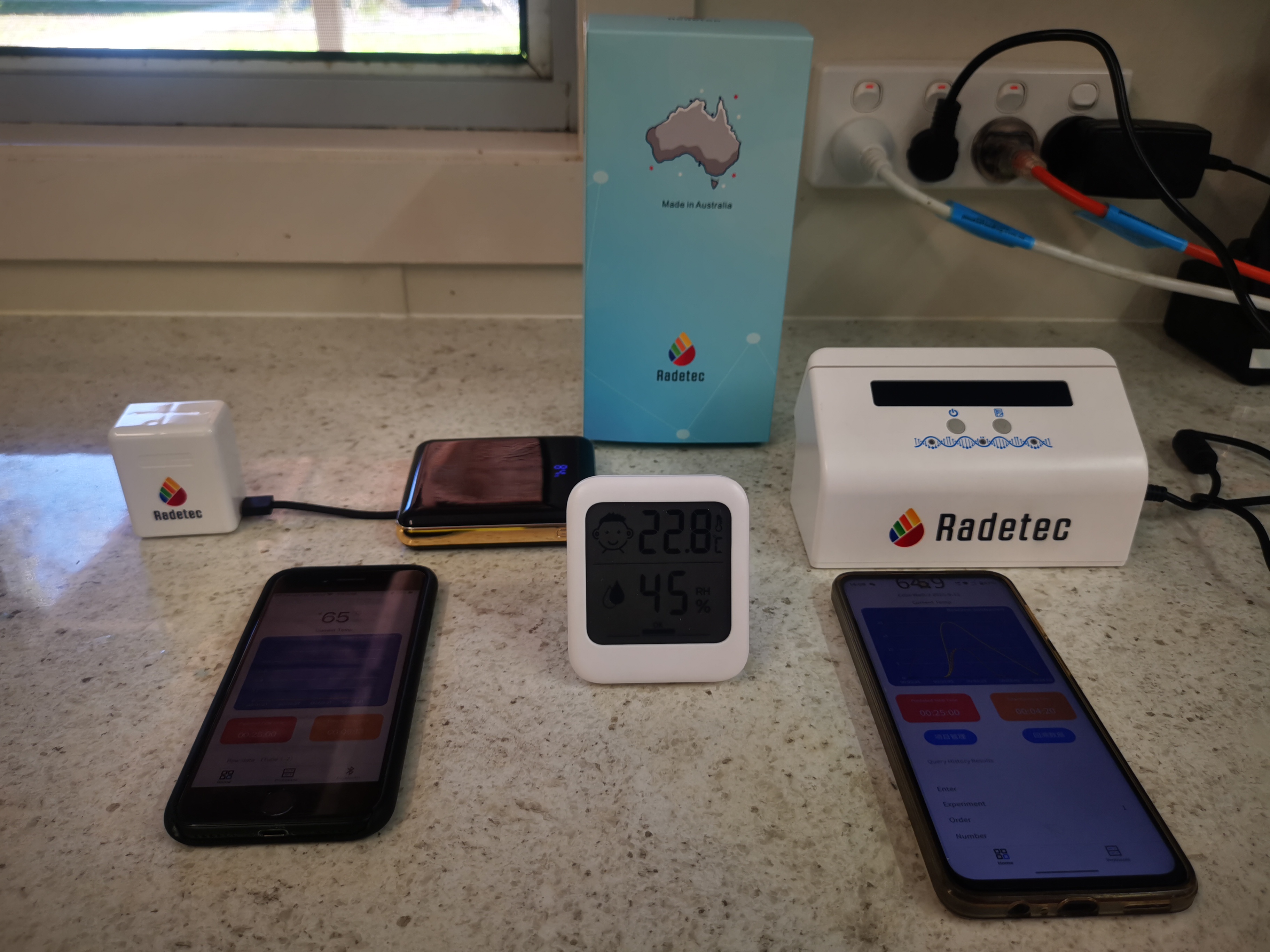 Radetec portable and benchtop molecular instruments set up in a laboratory, with mobile readout